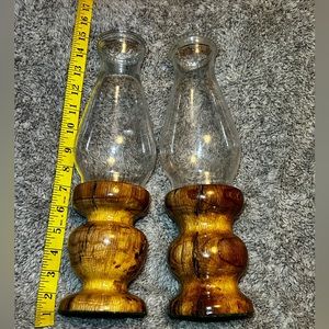 Set of 2 oil/candle hurricane lamps. Solid oak base with glass chutes holds